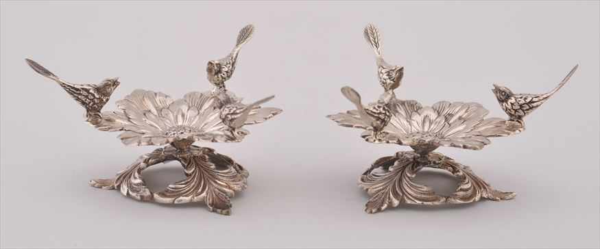 Appraisal: PAIR OF CONTINENTAL SILVER STANDS Each modeled with three birds