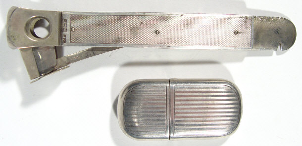 Appraisal: Silver handled cigar cutter Birmingham together with a silver cased