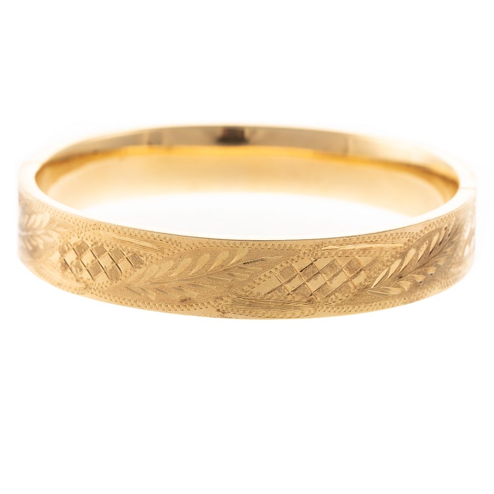 Appraisal: An Engraved K Bangle Bracelet K yellow gold oval hinged