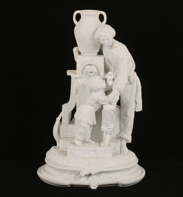 Appraisal: Parian biscuit ware statue man with child next to decorated