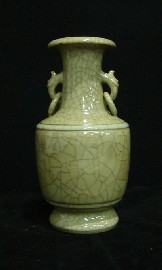 Appraisal: A buff toned crackle glazed ring formed double handled baluster