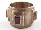 Appraisal: A white metal tests silver garnet ring approx mm wide