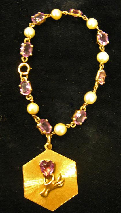 Appraisal: karat yellow gold amethyst and pearl braceletComposed of eight oval