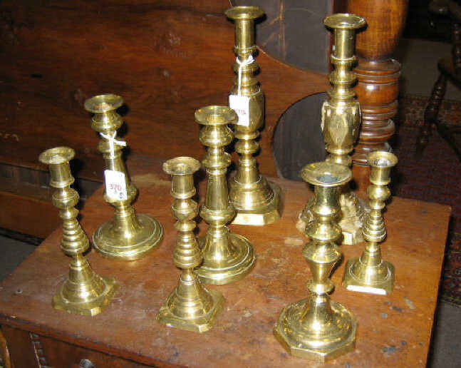 Appraisal: EIGHT ENGLISH BRASS CANDLESTICKS Three pairs including the Prince of