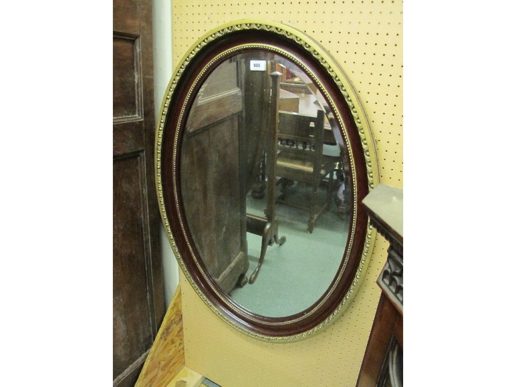 Appraisal: Gilt wood and rosewood veneered oval wall mirror