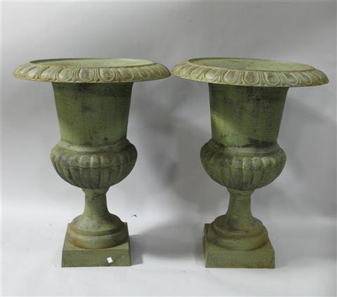 Appraisal: PAIR OF LARGE CAST IRON URNS The simple urns colored