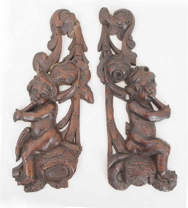 Appraisal: PAIR OF CONTINENTAL BAROQUE STYLE CARVED WALNUT SMALL WALL APPLIQUES