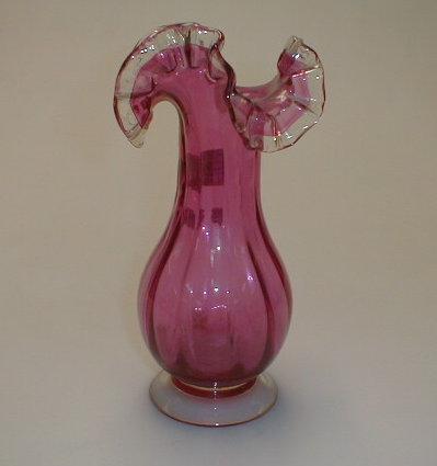 Appraisal: A cranberry glass vase with wavy rim high