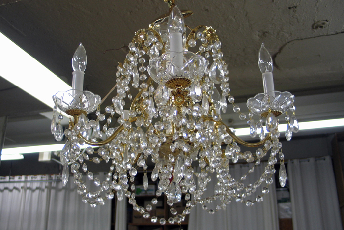 Appraisal: A HANGING CUT CRYSTAL CHANDELIER having cut crystal drops and