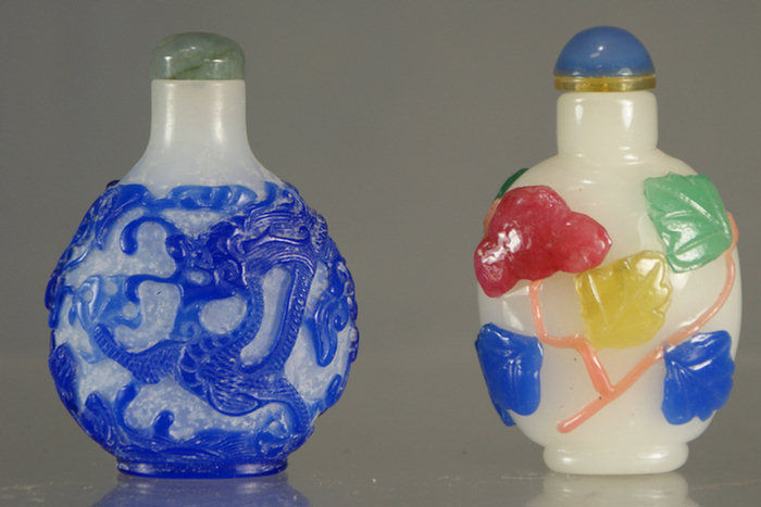 Appraisal: overlay glass snuff bottles blue dragon design color leaf design