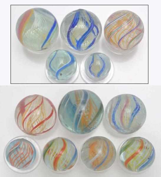 Appraisal: Lot of Latticino Swirl Marbles Description Includes four alternating yellow