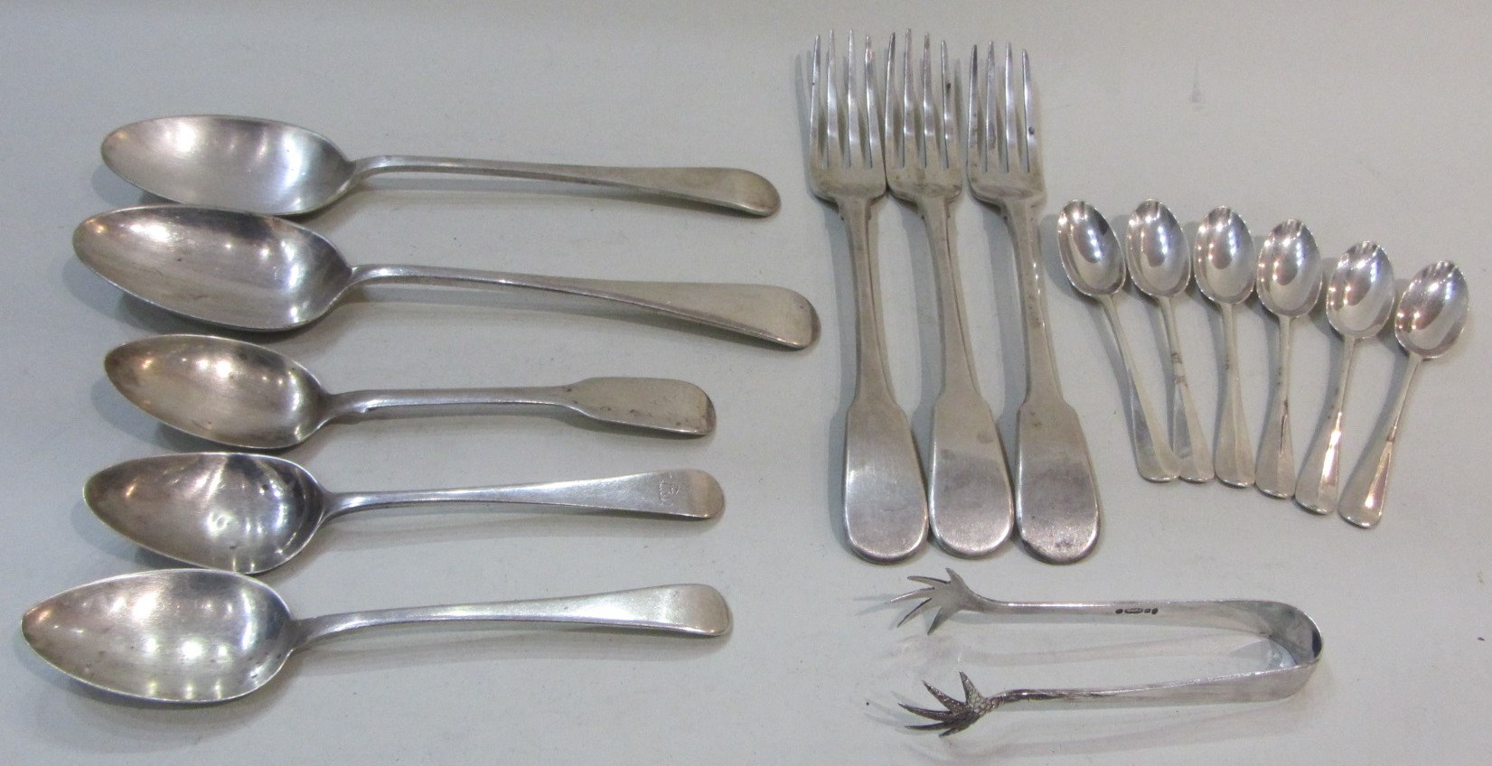 Appraisal: Silver table flatware comprising three fiddle pattern table forks London