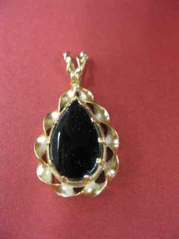 Appraisal: k Gold Black Onyx Pendant teardrop stone in yellow gold