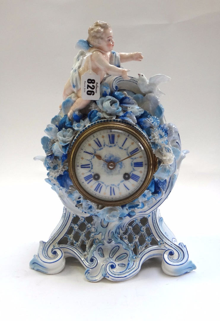 Appraisal: A French porcelain mantel clock early th century surmounted with