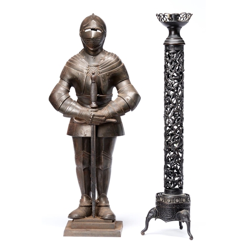 Appraisal: A cast iron armoured knight figural companion stand second quarter