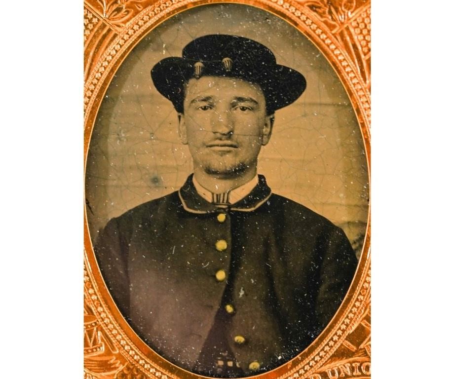 Appraisal: Ambrotype of a Civil War soldier wearing a hat mounted