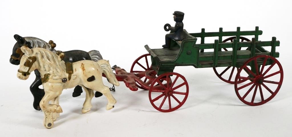 Appraisal: CAST IRON HORSE DRAWN WAGONMid th C open slat sided