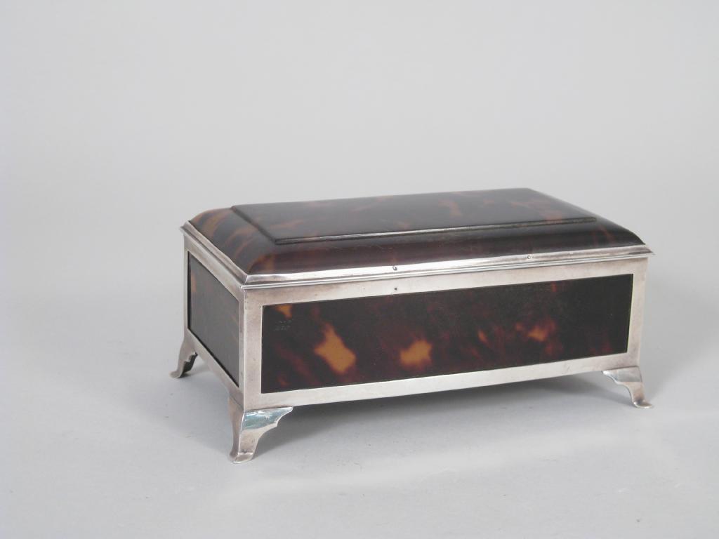 Appraisal: A George V silver mounted tortoiseshell Casket of sarcophagus shape