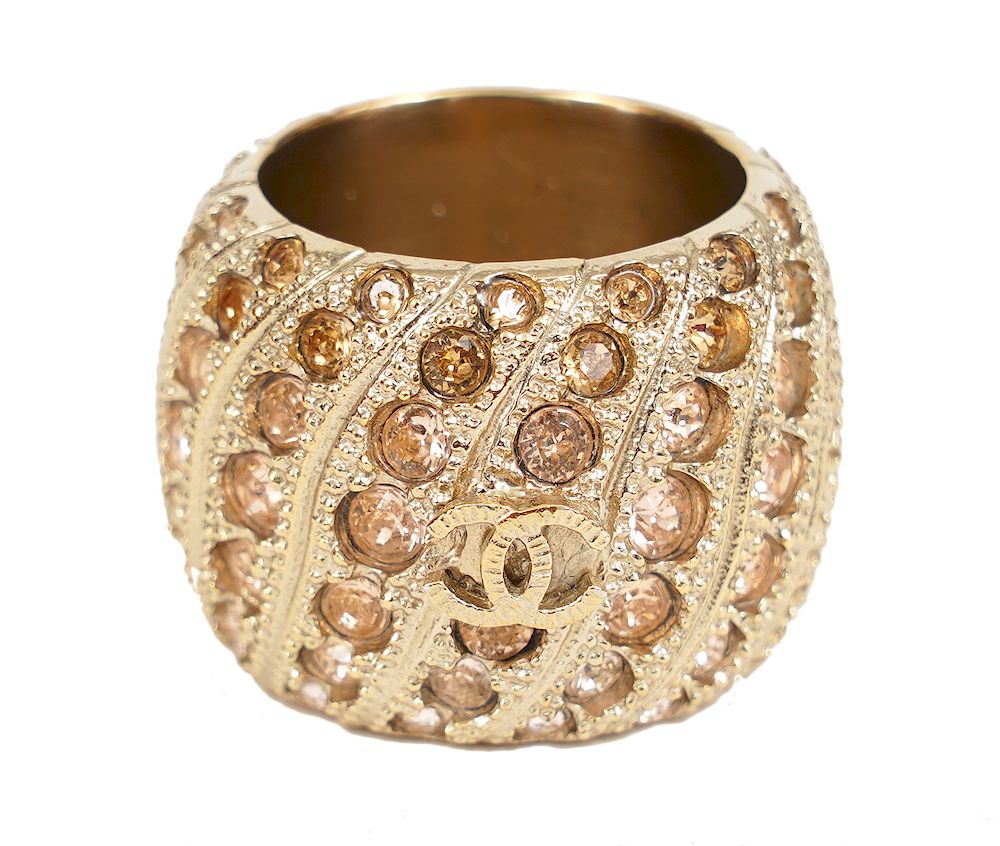 Appraisal: Chanel Wide Gold Band Pink Strass Crystal Ring This Chanel