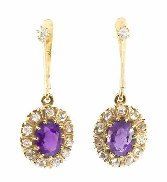 Appraisal: A Pair of Yellow Gold Amethyst and Diamond Earrings containing