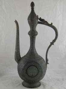 Appraisal: A th century heavy copper Islamic ewer finely decorated overall