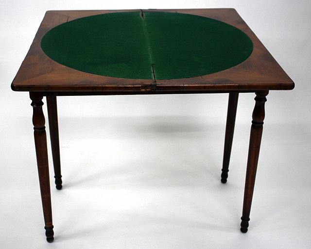 Appraisal: A TH CENTURY ROSEWOOD RECTANGULAR FOLDOVER CARD TABLE with circular