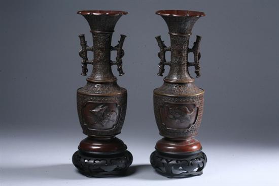 Appraisal: PAIR JAPANESE BRONZE VASES Molded with two handles bird and