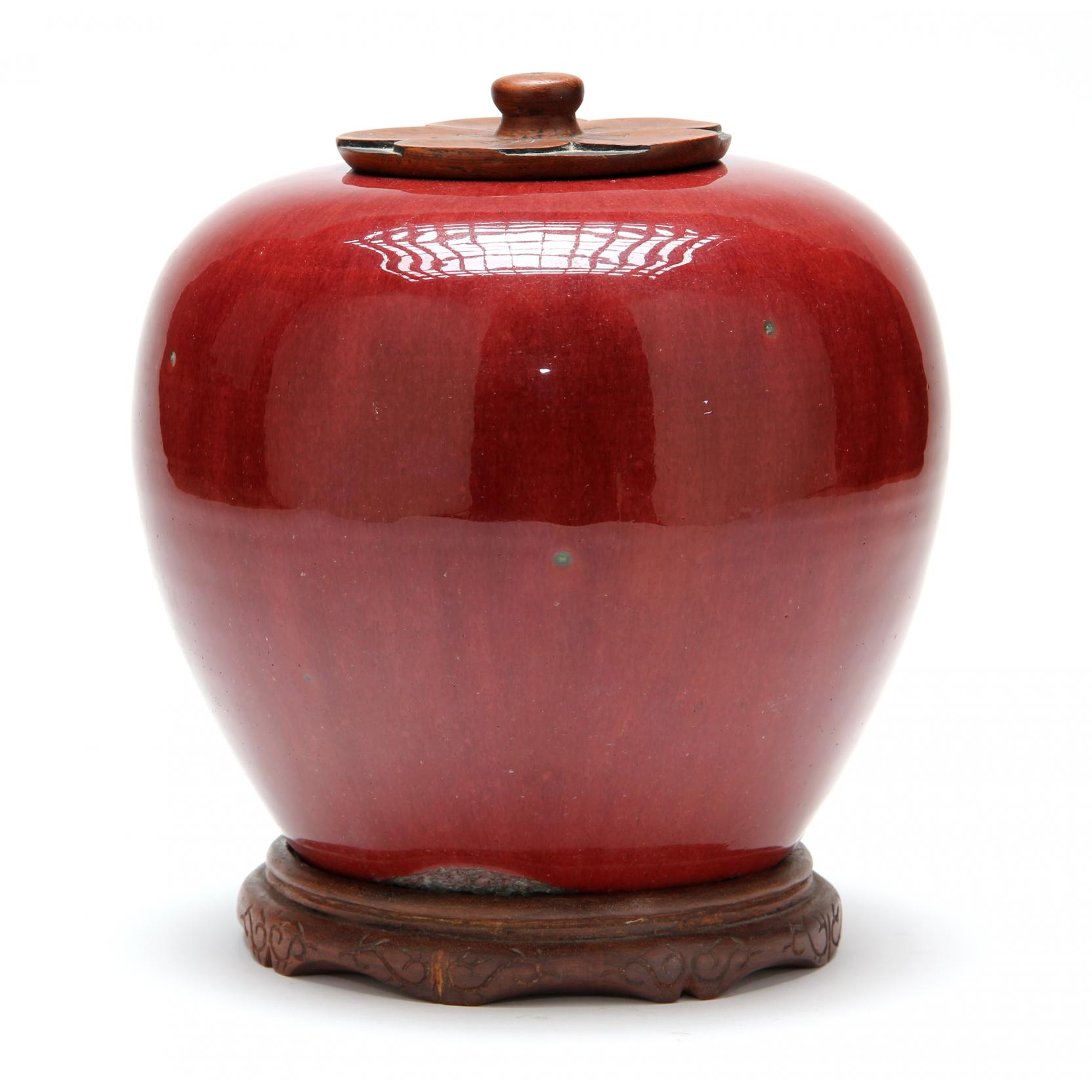 Appraisal: Chinese Oxblood Sang de Boeuf Jar with Carved Wooden Lid