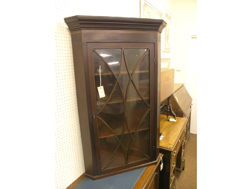 Appraisal: A George III inlaid mahogany hanging corner cabinet astragal-glazed door