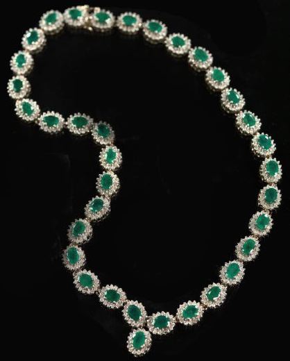 Appraisal: Fourteen-Karat Yellow Gold Emerald and Diamond Necklace the flexible ribbon