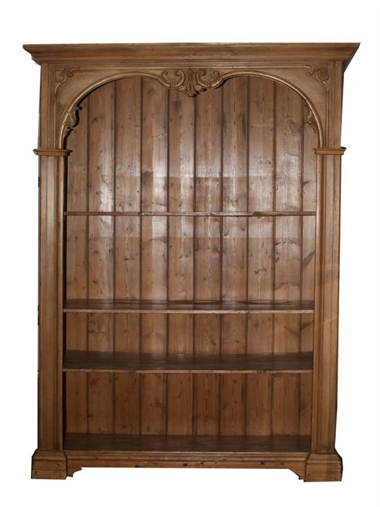 Appraisal: CONTINENTAL SCRUBBED-PINE BOOKCASE th century with adjustable shelving Molded crown