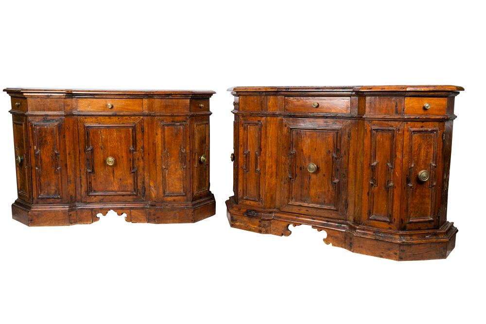 Appraisal: PAIR OF TUSCAN BAROQUE CONSOLE CABINETSeach with angled front corners