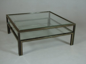 Appraisal: A large square coffee table the black frame inlaid with