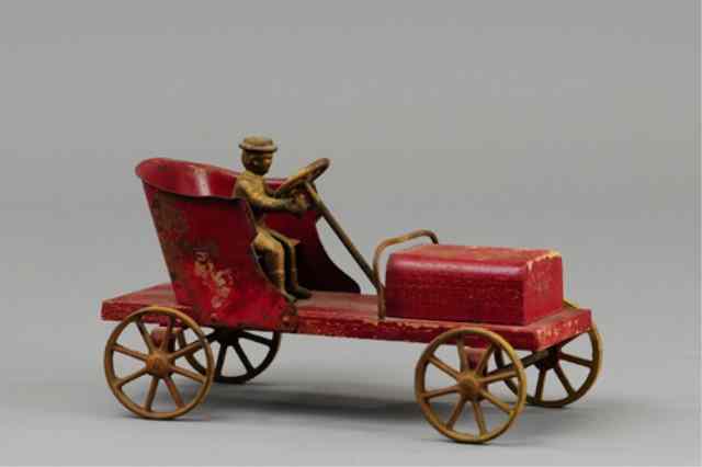 Appraisal: THE FIRST ARCADE AUTO Early example made of wood tin