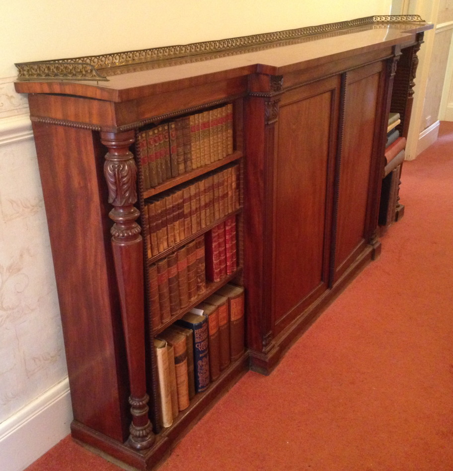 Appraisal: A William IV flamed mahogany breakfront cabinet bookcase with open