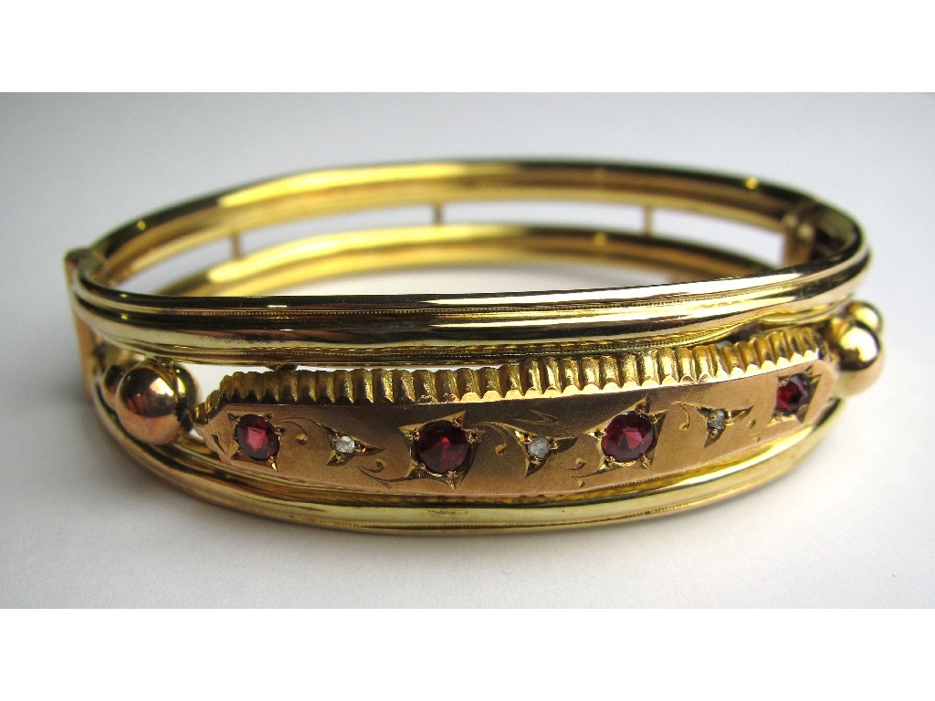 Appraisal: Victorian ct gold diamond and ruby set hinged bangle