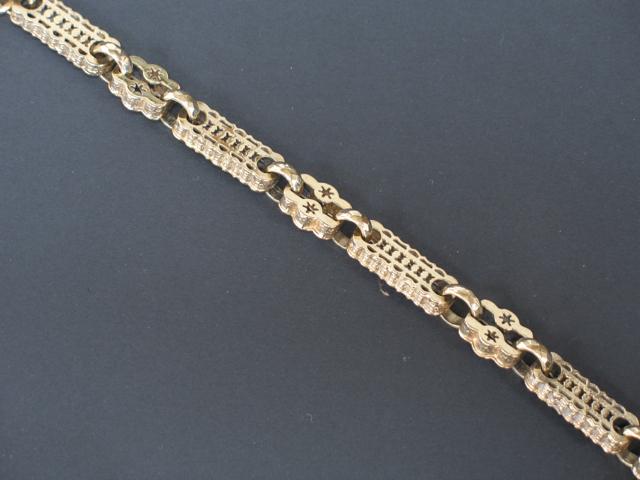 Appraisal: A CT YELLOW GOLD BRACELET with ornate pierced rectangular links