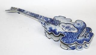 Appraisal: Delft porcelain string instrument form wall planter Delft porcelain string