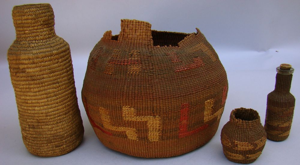 Appraisal: FOUR INUIT BASKETS th Century Basketry-covered bottle form Height Small