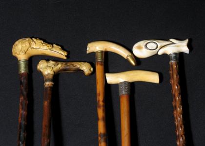 Appraisal: Group of five walking sticks with bone brass and composition