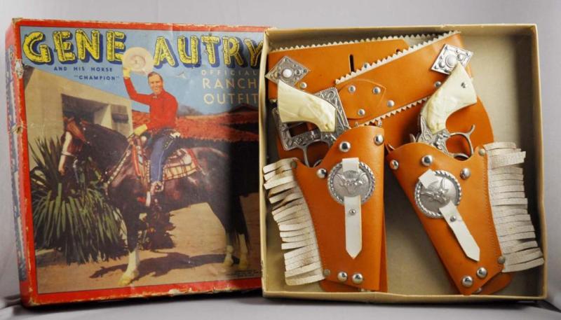 Appraisal: Gene Autry Double Holster Ranch Outfit Set Description Includes two