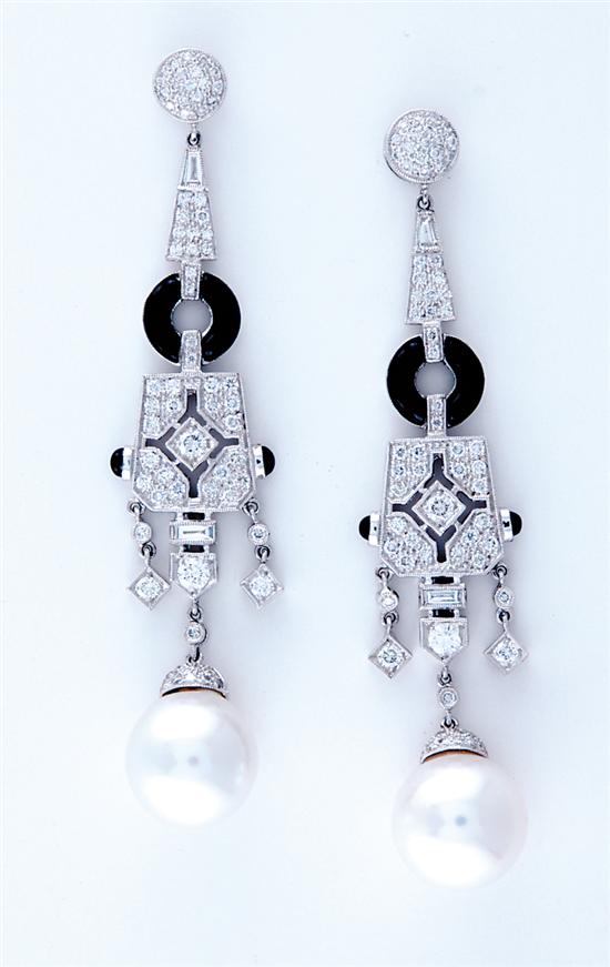 Appraisal: South Sea pearl diamond and onyx earrings two pearls mm