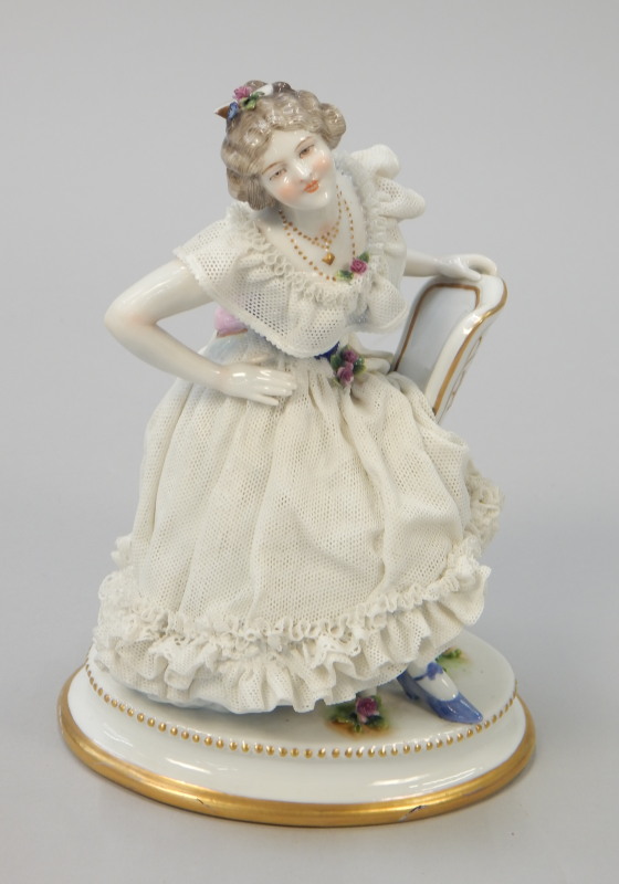 Appraisal: A Dresden porcelain crinoline lady modelled in the form of