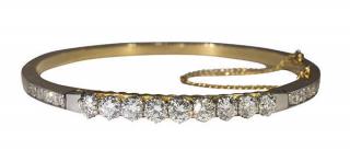 Appraisal: Diamond k yellow gold and platinum bangle bracelet Diamond k