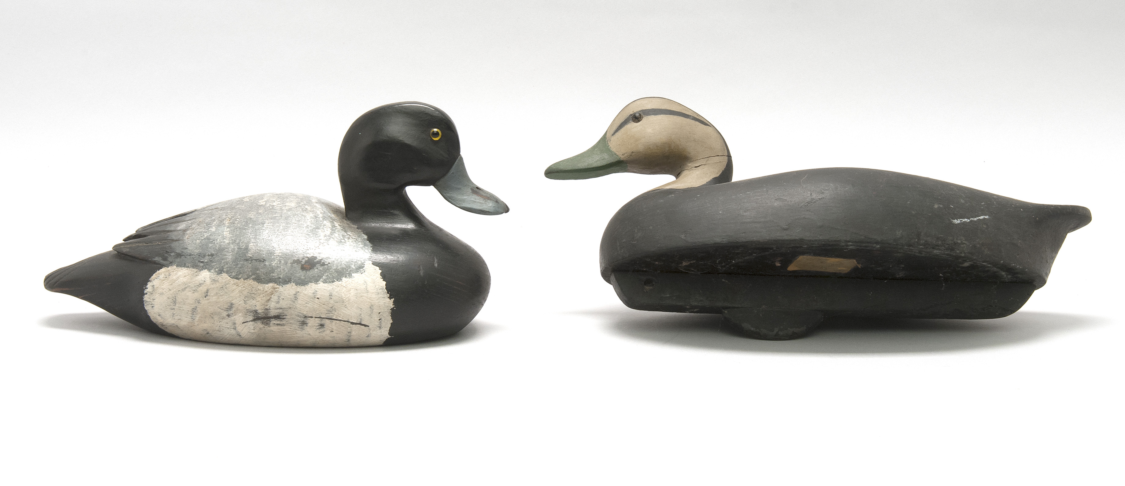 Appraisal: TWO WATERFOWL CARVINGS a repainted hollow-carved black duck decoy by