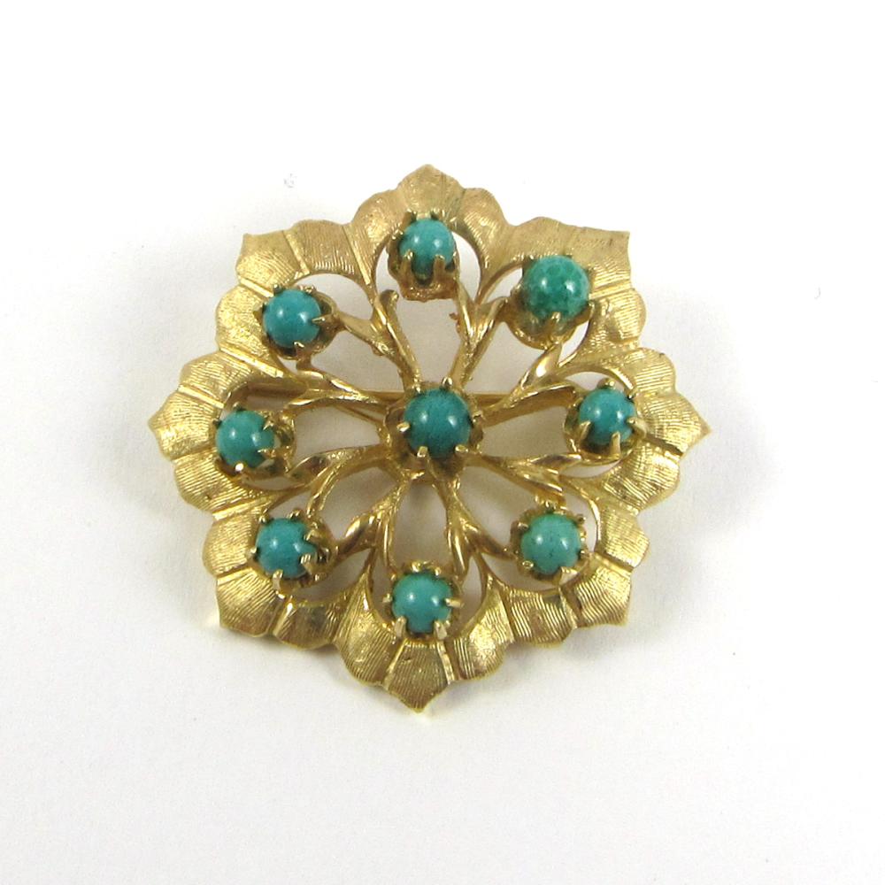 Appraisal: TURQUOISE AND FOURTEEN KARAT GOLD BROOCH a round flower-form brooch