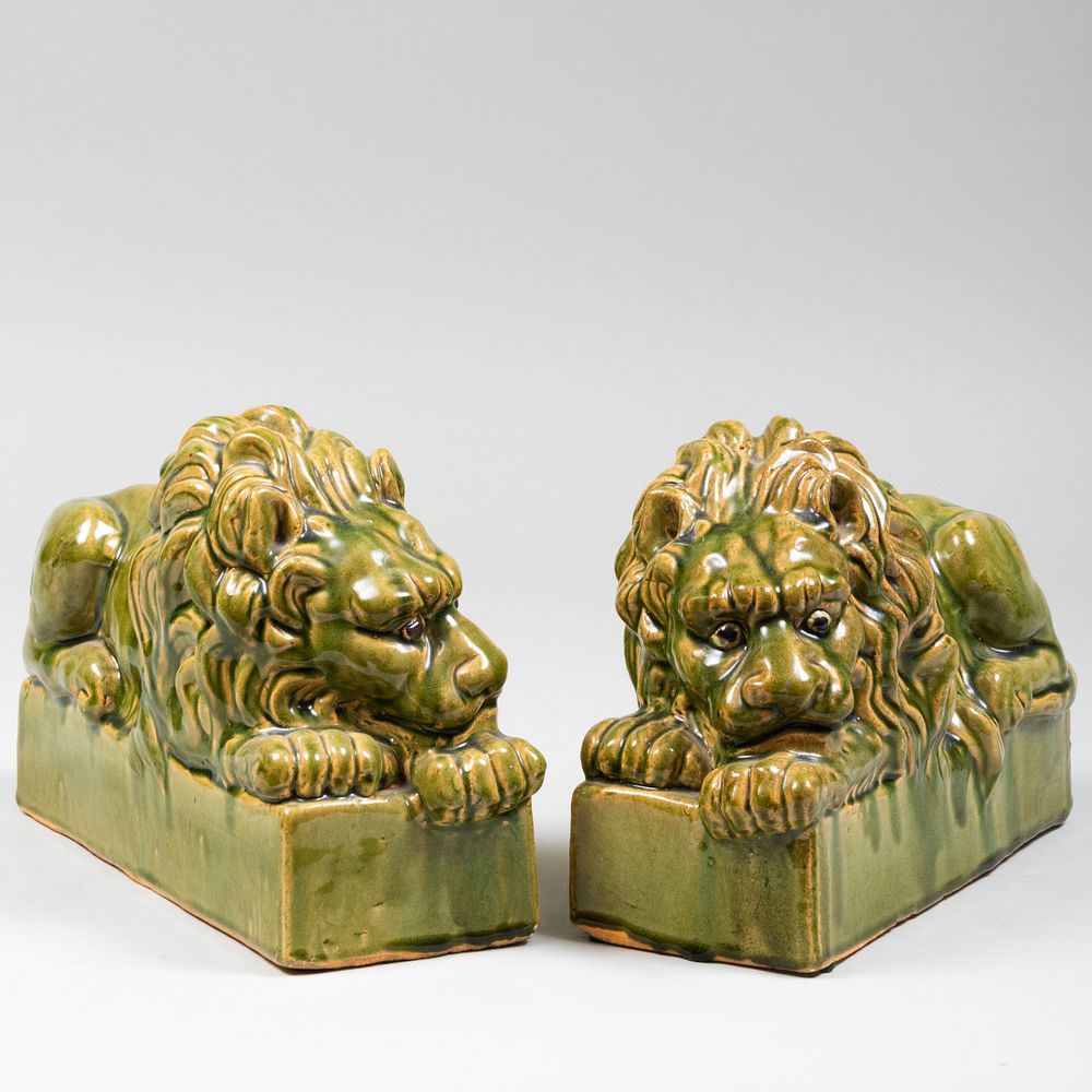 Appraisal: Pair of Green Glazed Models of Recumbant Lions x x