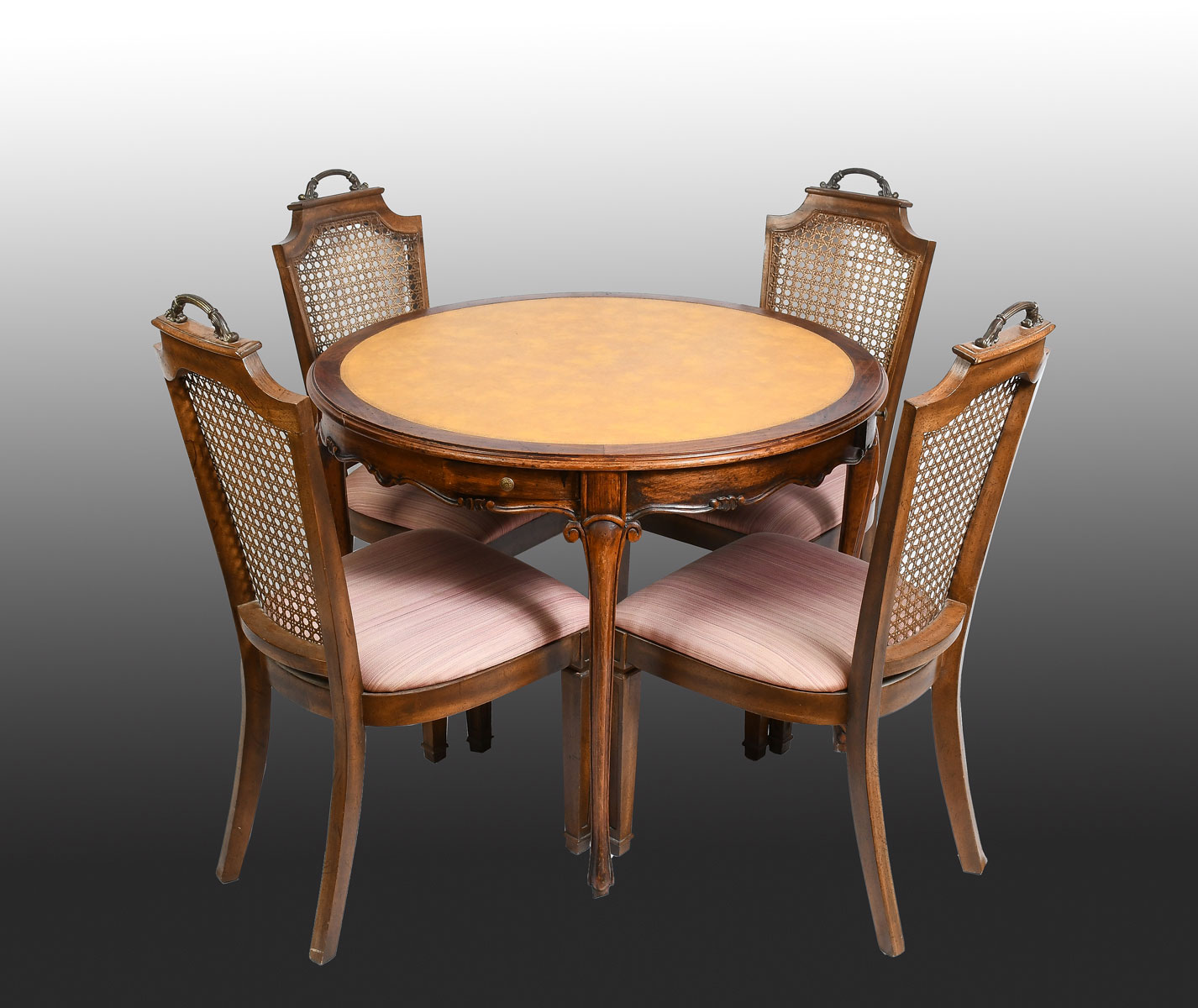 Appraisal: LEATHER TOP GAME TABLE WITH CANE BACK CHAIRS Variegated yellow