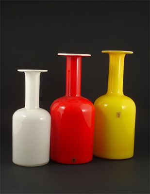 Appraisal: Three Holmegaard glass bottles graduated white glass cased in yellow