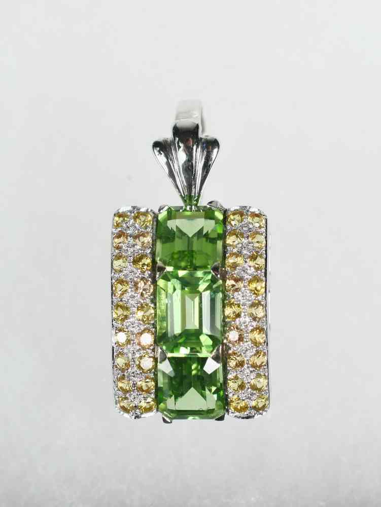 Appraisal: PENDANT - One K white gold peridot and topaz slide